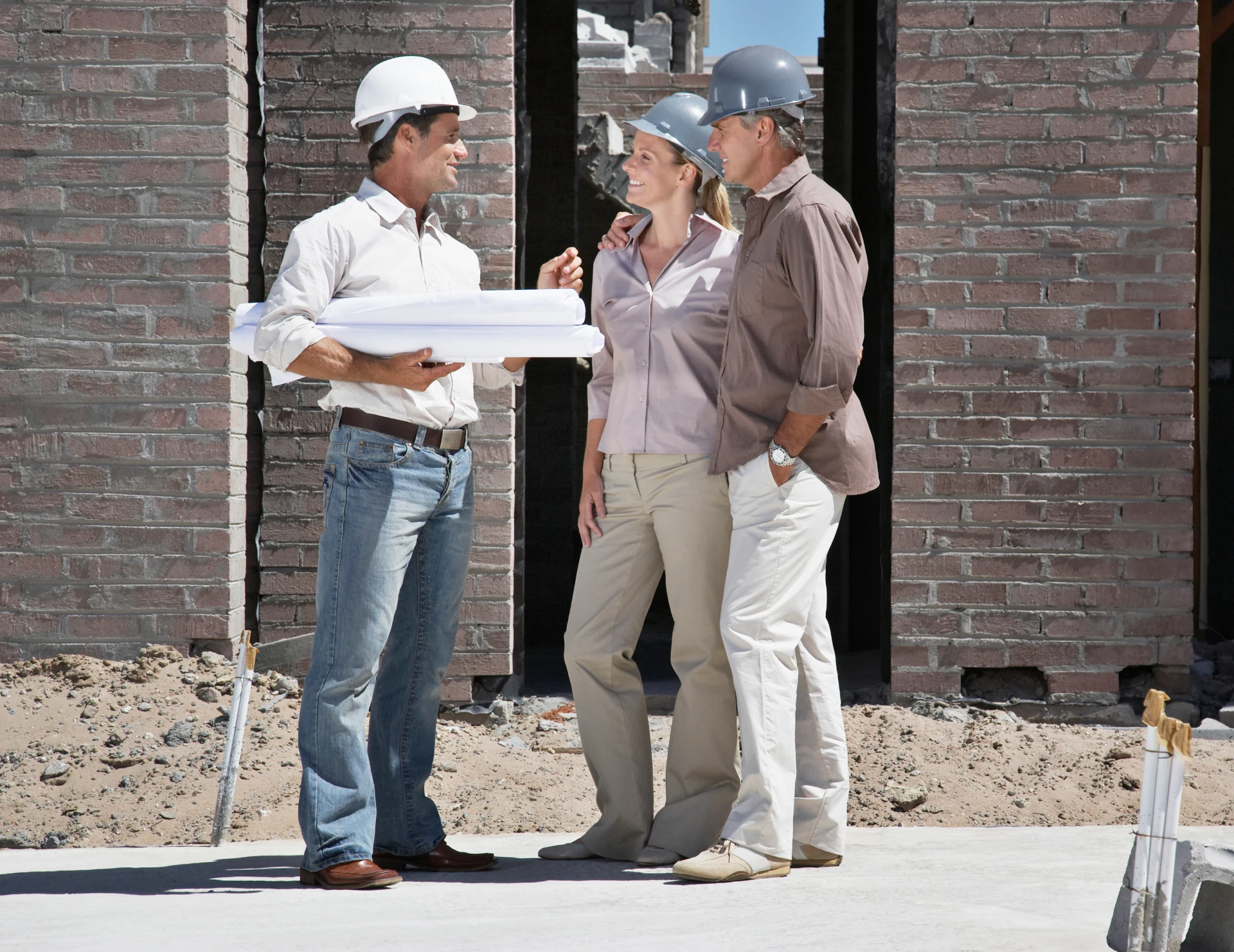 Construction team discussing building plans